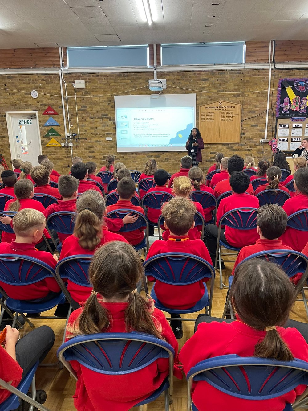 A photo showing a year-group being presented to by a Kooth Engagement Lead